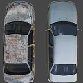 Two Cars Parked Side By Side With White And Rusted Damaged Exteriors