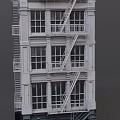 Multi story European Architecture Exterior With White Facade Windows And Fire Escapes