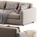 Comfortable Beige Multi Seater Sofa With Plaid Striped Blankets And Decorative Pillows