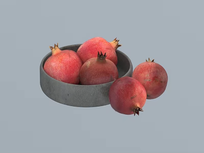 Fresh Ripe Red Pomegranates Placed in Gray Bowl with One Outside 3d model
