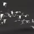 Flock of white birds flying against dark background in mid air