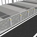 Silver Bollards With Yellow Tops Along Paved Sidewalk Near Tree Shadows
