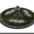 Roadside Circular Flower Bed Facility With Fountain Stone Pedestal Colorful Flowers And Green Plants