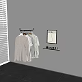 Clothes Hanger Holding Light Gray Sweaters And Striped Shirts With VOGUE Poster And Minotti Sign