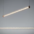 Modern Long Cylindrical Pendant Lights With Transparent Crystal Design Hanging In Interior