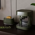 Modern Kitchen Countertop With Green SMEG Coffee Machine And Toaster With Bread And Plants