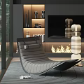 Gray Lounge Chair with Comfortable Design in Modern Interior with Fireplace Flames and Decorative Sculptures