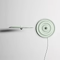 Modern Lighting Combination Featuring Flat Disc Pendant Light and Circular Wall Lamp with Concentric Patterns