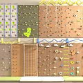 Kids Play Area With Various Climbing Walls Dinosaur Motifs Colorful Holds And Wooden Panels