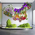 Art Installation With Colorful Flowers Green Sculptural Elements And White Pebbles In Modern Space