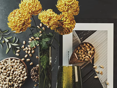 Yellow Chrysanthemums in Glass Vase with Nuts Pine Cones and Olive Branches Around 3d model