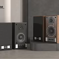 POLIFORM Modern Speakers With Black And Walnut Wood Design On Gray Countertop