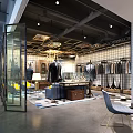 Elegant Fashion Clothing Store Interior With Suit Mannequins Sofa Chandelier And Large Windows