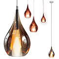 Modern Teardrop Shaped Amber Glass Pendant Lights Illuminated Hanging In Interior Space