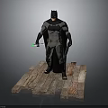 Batman in Gray and Black Suit with Cape Standing on Wooden Platform Holding Green Gadget
