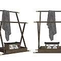 Natural Wooden Clothing Rack With X Shaped Frame Bottom Tray Decorative Stones And Light Towel