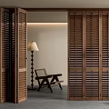 Wooden Slatted Folding Doors in Modern Interior With Chair Floor Lamp And Plant