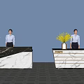 Modern Reception Desk With Marble Counter Potted Plant And Person Standing