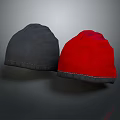 Two Gray And Red Velvet Fabric Hats With Stitched Edges On Dark Background