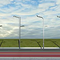Modern Outdoor Street Lights Along Road With Green Grass And Clear Sky