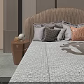 Modern Double Bed With Textured Headboard Multiple Pillows Patterned Quilt And Wooden Chair