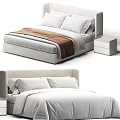Modern Double Bed with Upholstered Headboard Soft Pillows White Linens and Wooden Nightstand