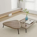 Wooden Coffee Table With Unique Shape In Minimalist Interior On Rug With Potted Plant