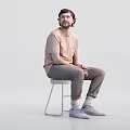 Two Men Sitting on White Stools Wearing Beige T-Shirts and Khaki Pants