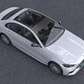 White Mercedes Benz Sedan With Sleek Front Design And Alloy Wheels