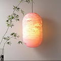 Pink Lantern With Floral Pattern Hanging By Bamboo Branch On Indoor Wall