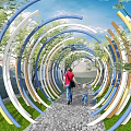 Colorful Curved Arches Garden Landscape With Pedestrian Path Adults Children Walking Green Trees And Grass