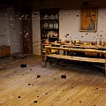 Vintage Room Interior With Wooden Floor Long Table Chairs Shelf Plates And Painting On Wall