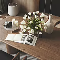 Decorative Ornament Combination With White Tulips Vase Open Book Camera And Candles On Wooden Table
