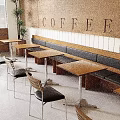 Modern Coffee Shop Interior With Bench Seating Wooden Tables Chairs And COFFEE Wall Sign