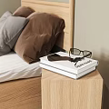 Cozy Modern Bedroom Interior With Wooden Bedside Table Stacked Books Glasses And Gray Brown Pillows