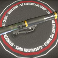 Military Rocket Launcher with Green Camouflage Design Yellow Stripe Accents Tactical Grip and Metal Body