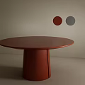 Round Red Dining Table with Cylindrical Base against Light Colored Wall and Two Circular Decorations 3d model
