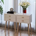 Modern White Bedside Tables with Drawers Wooden Handles Books Decorative Ornament Red Vase White Flowers