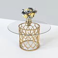 Gold Base Coffee Table With Transparent Glass Top And Vase With Yellow Gray Flowers