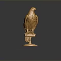 Golden Eagle Statue Beautifully Displayed on Shiny Pedestal Against Black Background