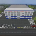 Aerial View of White Office Building With Blue Accents Along Road Trees and White Clouds