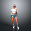 Woman In White Cropped Top And Denim Shorts With White Sneakers On Gray Background