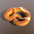 Golden Salted Pretzel With Twisted Shape And White Salt Crystals