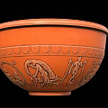 Orange Ceramic Bowl With Ancient Figural Carvings And Decorative Patterns As Household Item