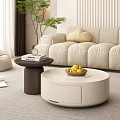 Round White Coffee Table In Modern Living Room With Bowl Of Lemons And Side Table