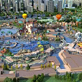 Aerial View Planning of Amusement Park with Rides Water Features Hot Air Balloons and Greenery