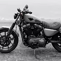 Classic Black And White Motorcycle With Leather Seat Black Engine Parked On Road Cityscape