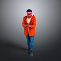 Man in Orange Jacket With Bandana Holding Phone Against Gray Background