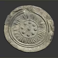 Ancient Stone Circular Relief Carving With Intricate Floral Patterns And Textured Surface