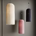 Stylish Fringed Pendant Lights White Pink And Dark Purple Against Gray Wall Interior